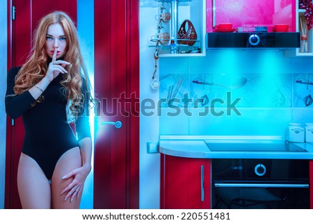 Fashion model with freckles on face in kitchen in cold tones