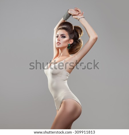 Square photo of beauty young model with creative hairstyle looking at camera in studio