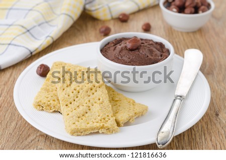homemade crackers and chocolate paste on a plate