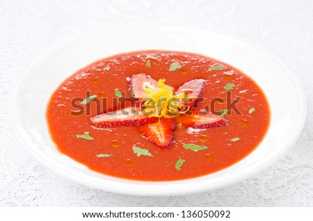 tomato and strawberry gazpacho in a plate, horizontal