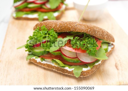 Healthy food - sandwich with cottage cheese, greens and vegetables, close-up, horizontal