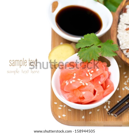 Asian food ingredients (ginger, soy sauce, rice), isolated on white, top view