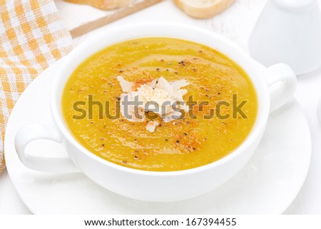 Cream soup of yellow lentils with vegetables, top view, close-up