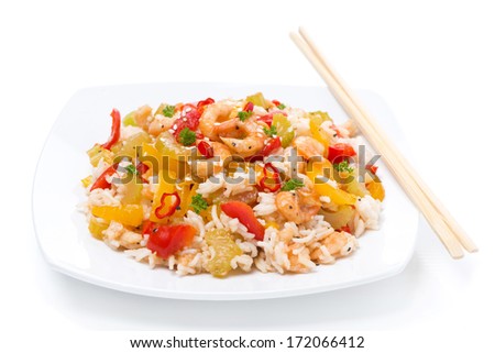 rice with vegetables and shrimps on the plate, isolated on white