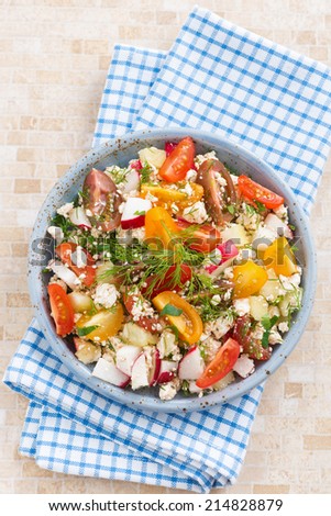 healthy food - salad with fresh vegetables and cottage cheese, top view, vertical