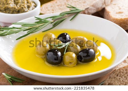 fresh olive oil and Italian snacks, close-up, horizontal