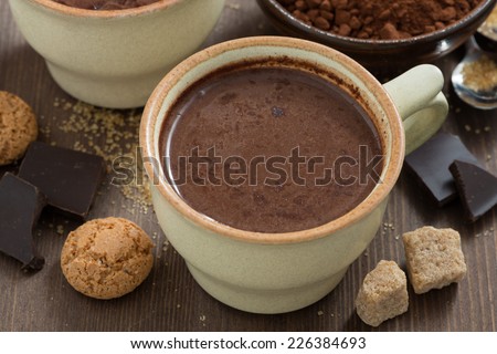 cup of hot chocolate and sugar cubes, top view, close-up