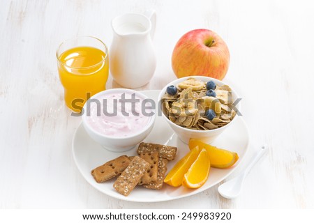 healthy breakfast - cereal, fruit, yogurt and juice, horizontal