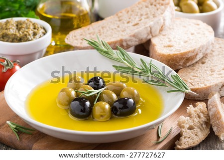 fresh olive oil and Italian snacks, close-up