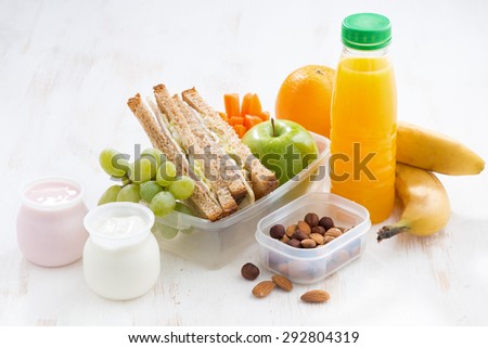 school lunch with sandwiches, fruit and yogurt, horizontal