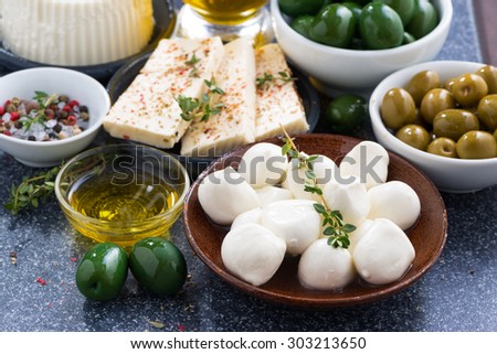 snacks - soft cheeses and pickles, close-up, horizontal