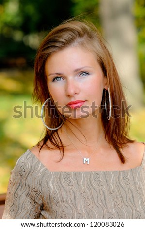 portrait of young woman with a healthy skin, on a background nature of summer
