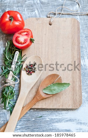 Background of a cutting board with spices and vegetables