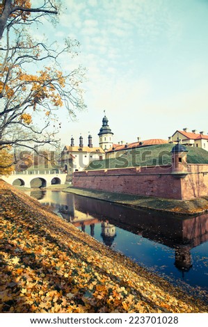 Belarusian tourist landmark attraction Nesvizh Castle - medieval castle in Nesvizh, Belarus/retro filter