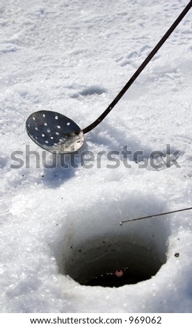 Tools of Ice Fishing - focus on dipper