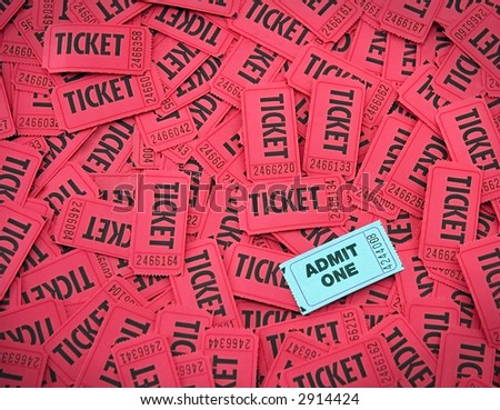 Admit One ticket on top of pile of red tickets