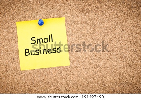 small business concept, sticky pinned to cork board with room for text.