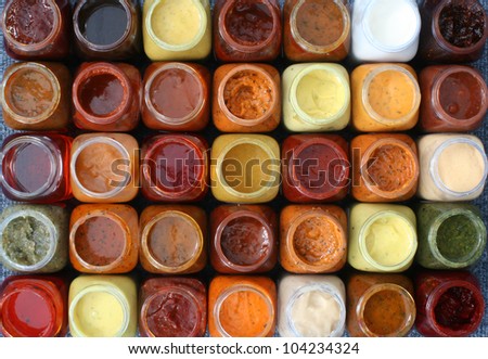 marinades and sauces in bottles, thirty-five pieces, top view with the cover open, isolated