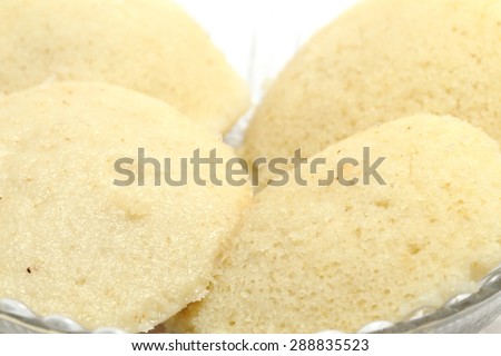 Idli - Sambhar an Indian food typically made in South India but liked and prepared almost in all parts of India, beautifully plated  in a glassware, isolated on white