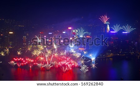 HONG KONG - 1 JANUARY: A splendid firework show and countdown celebration held in Hong Kong on 1 January, 2014. The show lasted for 8 minutes and lighted up the skies above Hong Kong skyscrapers.