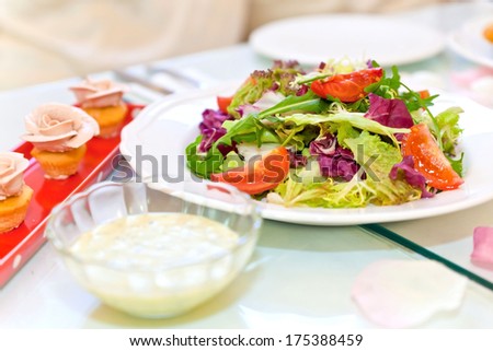 Fresh vegetable salad and cake