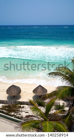 Sea Palm Beach umbrellas on the beach along the Caribbean Sea Mexico