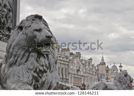 Lion monument guarding Trafalgar Square, London, England