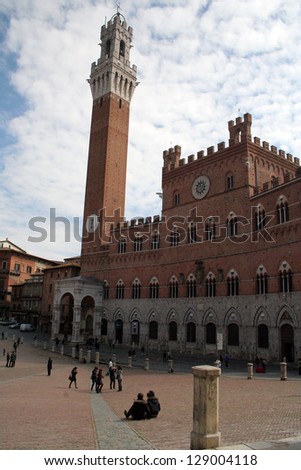 SIENA, ITALY--MARCH 19--Locals enjoy lunch in the Piazza del Campo of Siena on March 19, 2008.  Siena is Italy\'s most visited tourist attractions.