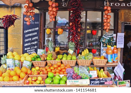 BROADWAY, ENGLAND-APRIL 9: A local market in Broadway, England displays fresh produce for purchase on April 9, 2013.The type of fresh and local produce is available depending on the time of year.