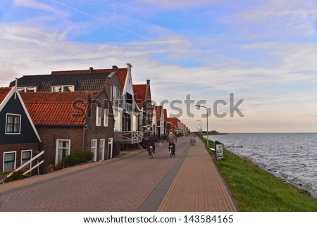 VOLENDAM, NETHERLANDS-APRIL 14: A view of a street of Volendam on April 14, 2013. Volendam is world famous thanks to its traditional costumes and its contributions to the world of music and sport.