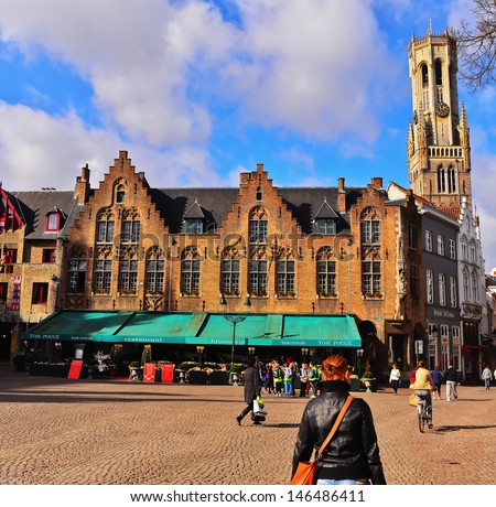 BRUGES, BELGIUM-APRIL 18: The market square of Bruges on April 18, 2013. Bruges has a significant economic importance thanks to its port. At one time, it was the \