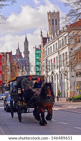 BRUGES, BELGIUM-APRIL 18: A  carriage ride in Bruges on April 18, 2013. Bruges has a significant economic importance thanks to its port. At one time, it was the \