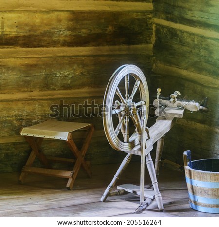 A spinning wheel for yarn sits in the corner of the Robert Scruggs cabin in Cowpens, South Carolina. He and his wife reared 11 children in the cabin.