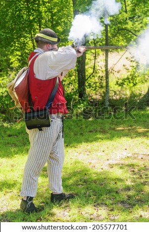 Cowpens, South Carolina--July 4:  A reenactment of the firing of a Revolutionary War musket at the battlefield of Cowpens, South Carolina to celebrate the country\'s freedom  on July 4, 2014.