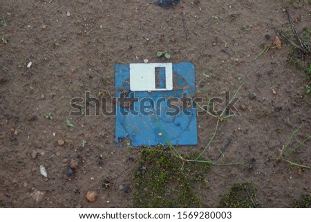 Similar – Image, Stock Photo A discarded floppy disk looks wistfully at the USB stick, which the mouse pointer prefers