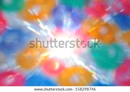 Sun rays and color circles abstract blur. Painted glass lens flare reflections.