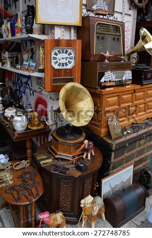 ATHENS, GREECE - APRIL 24, 2015: Vintage objects and furniture for sale at street market antiques shop.