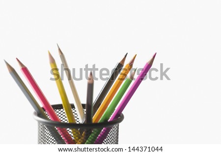Close-up of colored pencils in a desk organizer