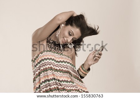 Woman listening to music and dancing