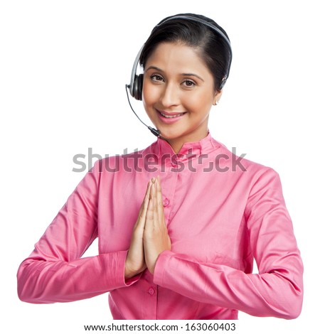 Portrait of a female customer service representative making greeting gesture