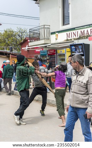 CONSTANTA, ROMANIA - MAY 01, 2014: Men fighting after getting drunk on streets of Vama Veche during opening of summer season