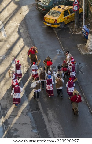 BUCHAREST, ROMANIA - DECEMBER 21, 2014:  Romanian  ritual the Bear Dance performed around Christmas Eve by participants with bells, whips and drums making noise to dispel the malevolent spirits.