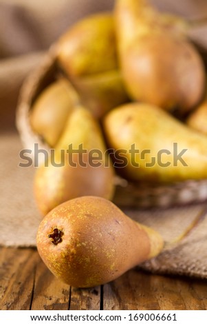 Pears on rustic wooden table