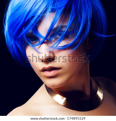 Portrait of beautiful girl with blue hair