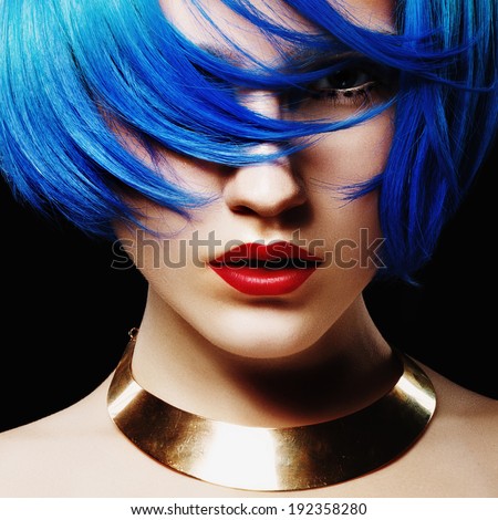 Portrait of beautiful girl with blue hair in the studio