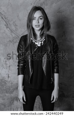 Portrait of a beautiful girl in a leather clothes, lifestyle, black and white photography