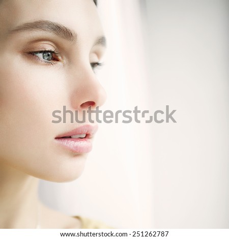 Portrait of a beautiful girl face close-up, concept of health and beauty