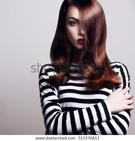 Portrait of a beautiful young girl with smooth hair
