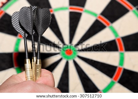 darts in a hand
