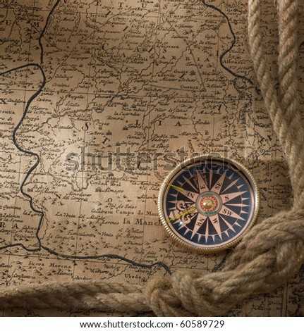 old compass and rope on vintage map 18 century